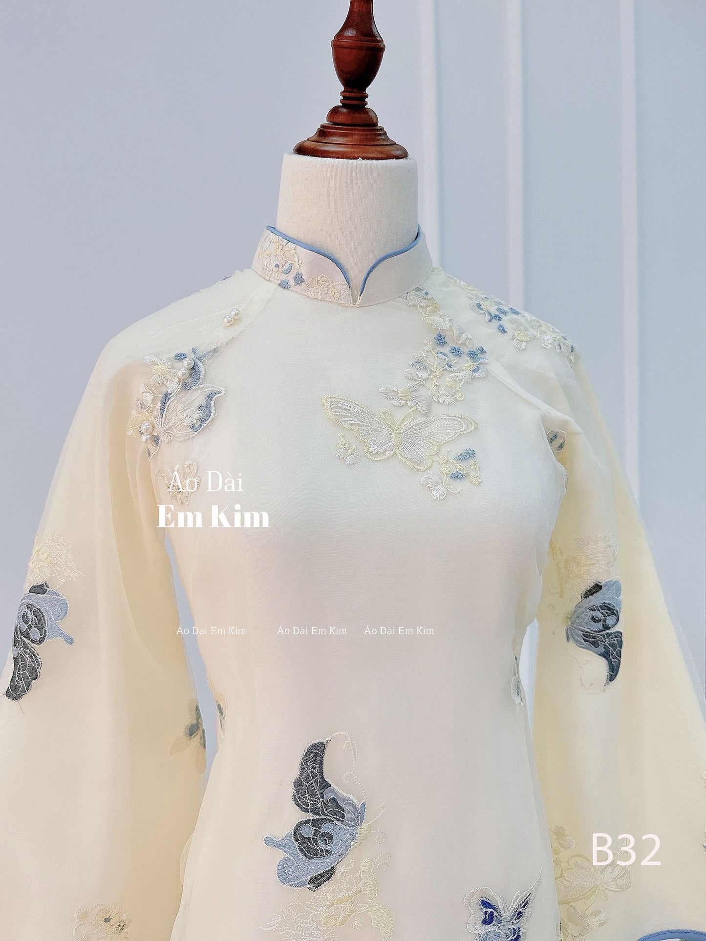 Light blue cream Ao Dai butterfly  B32